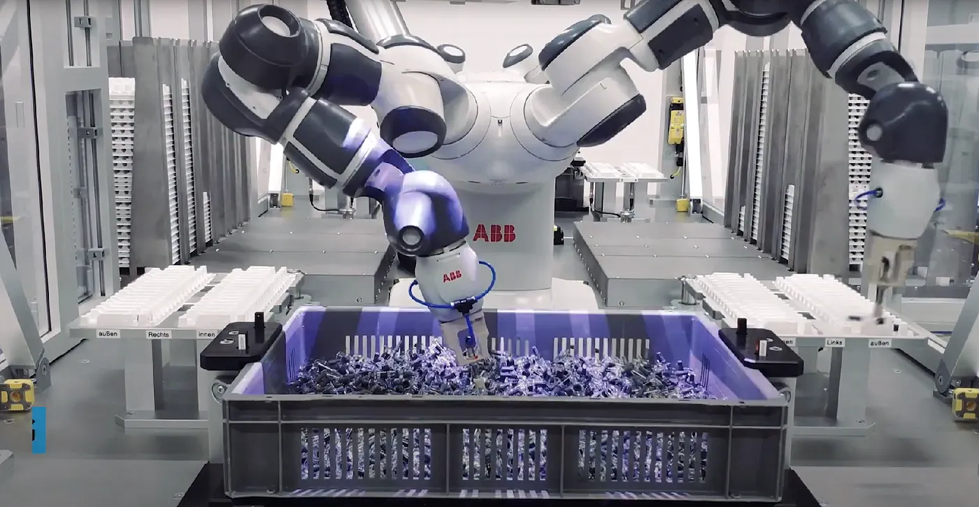 robot arm with camera looking at a cluttered bin